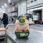 Brasil Halal Fresh Frozen Chicken being prepared for export in a cold storage warehouse, with Maersk Halal Cargo truck loading boxes labeled Pollo Brasil to Dubai